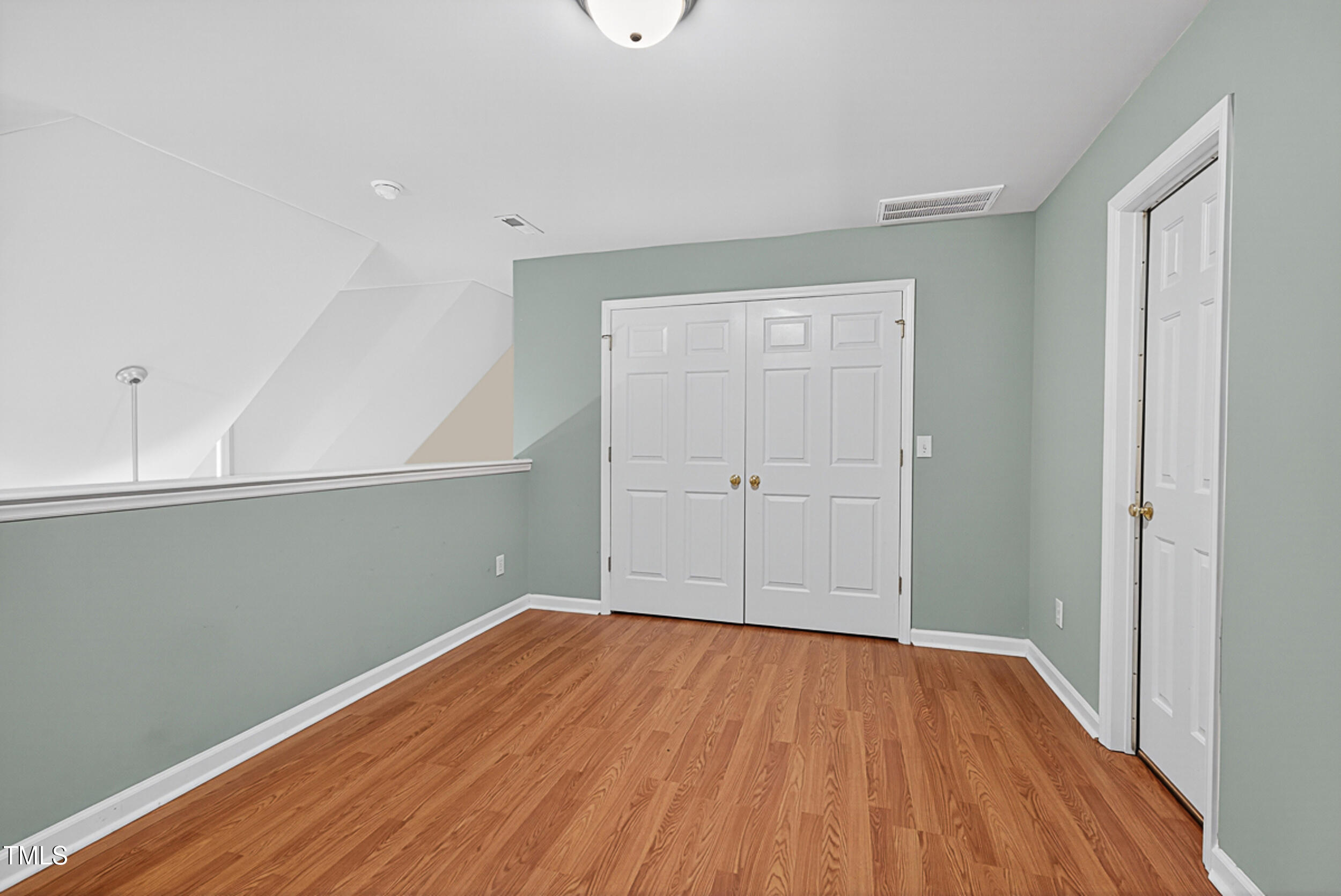 2407 Trout Stream Drive Raleigh, NC 27604 - Photo 23 of 26 a view of a room with wooden floor