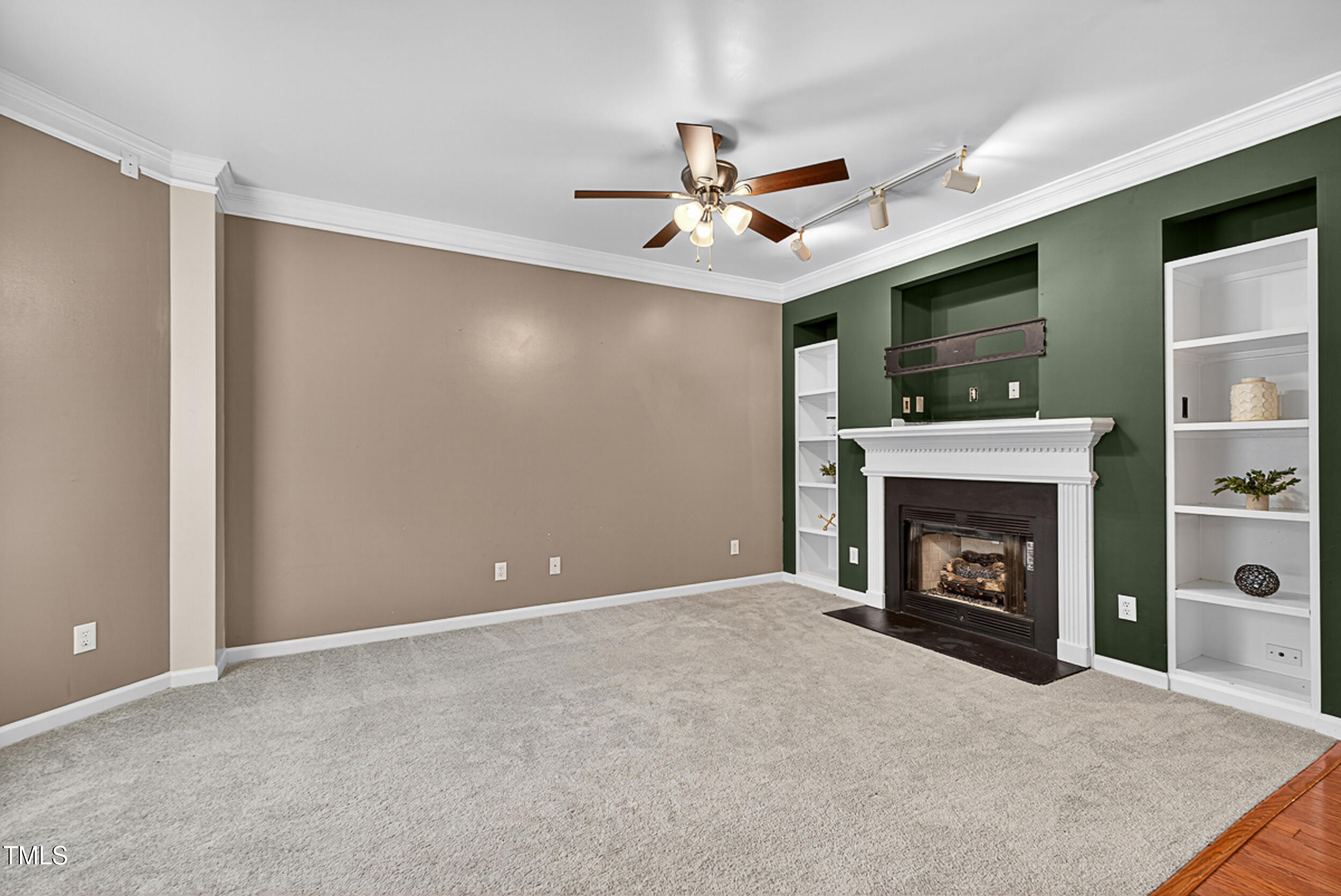 2407 Trout Stream Drive Raleigh, NC 27604 - Photo 7 of 26 a view of an empty room with a fireplace