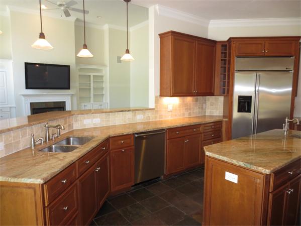 36 Open Space Drive Sandwich, MA 02563 - Photo 17 of 30 a kitchen with a sink and a refrigerator