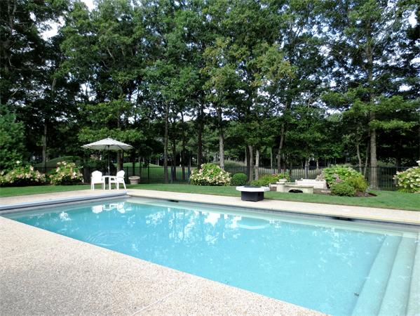 36 Open Space Drive Sandwich, MA 02563 - Photo 6 of 30 a view of a swimming pool and lounge chairs in back yard