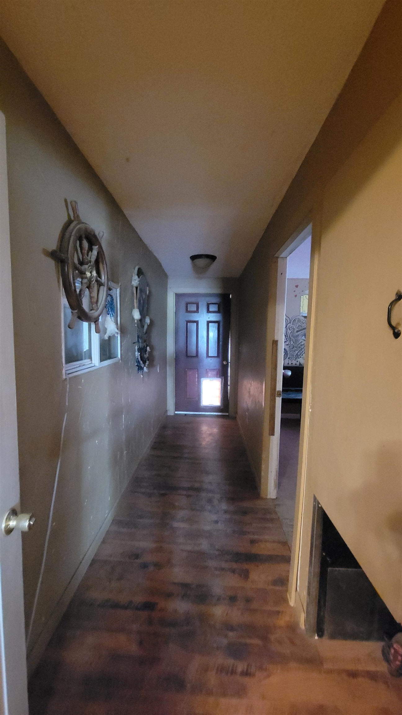 1844 M Road Fruita, CO 81521 - Photo 30 of 32 a view of a hallway with wooden floor