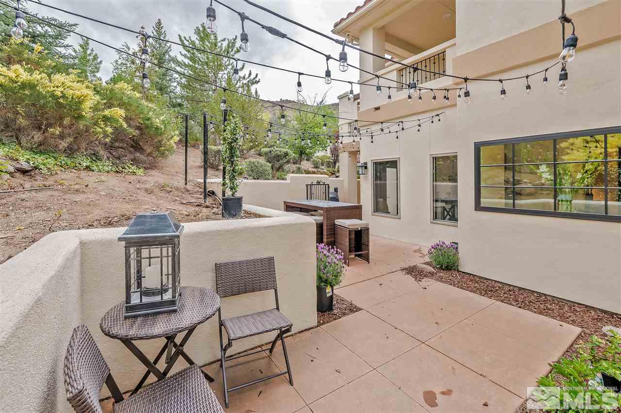 110 Sawbuck Road Reno, NV 89519 - Photo 36 of 40 a view of a patio with table and chairs and potted plants
