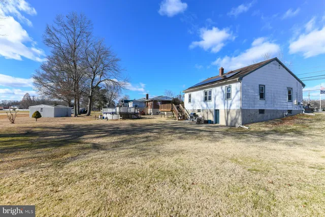 a view of a house with a yard from a balcony