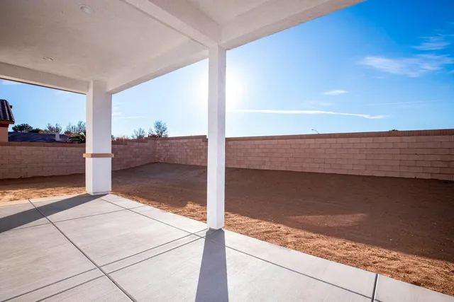 an aerial view of a residential houses with outdoor space