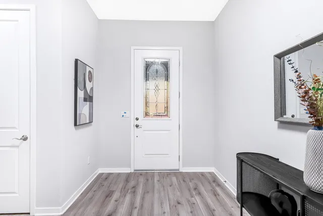 a view of room with window and wooden floor