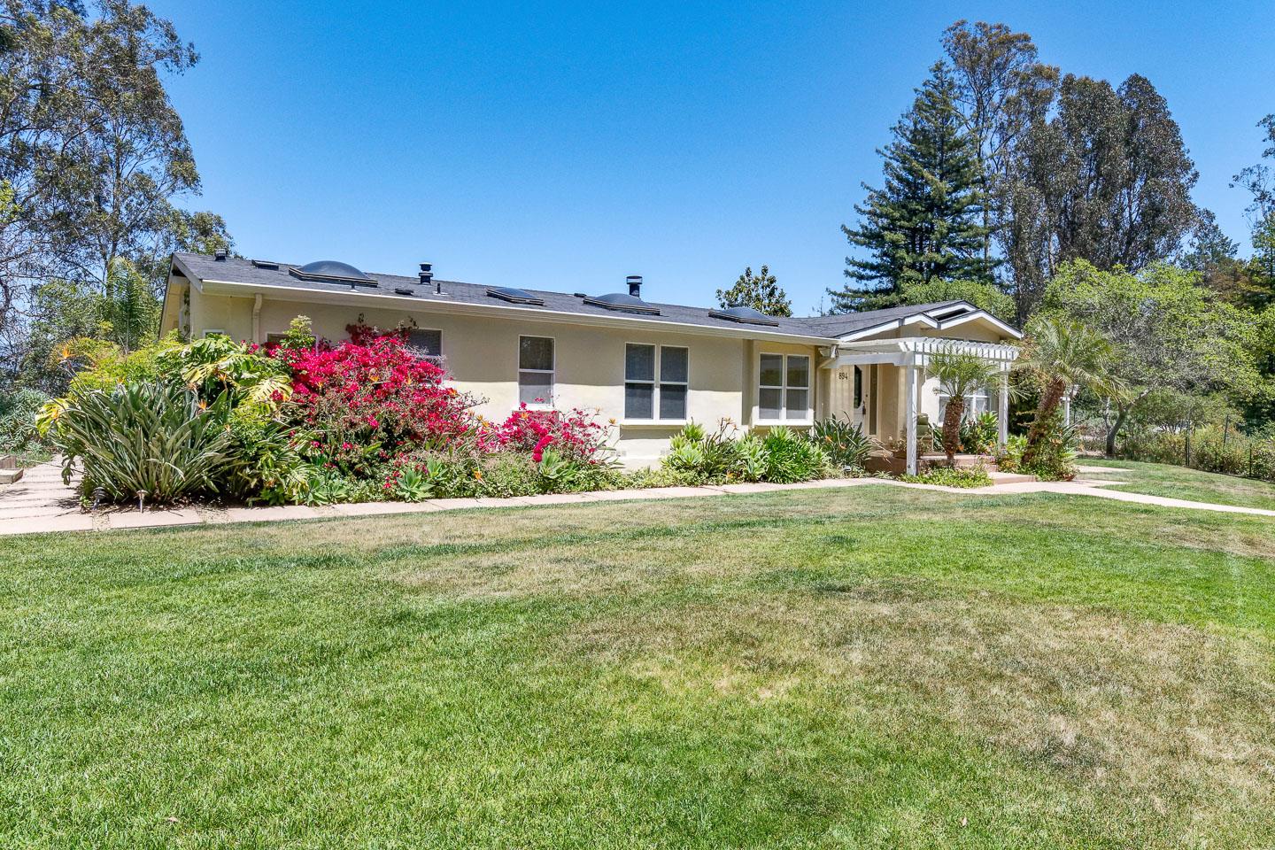 892-894 Calabasas Road Watsonville, CA 95076 - Photo 2 of 53 a front view of a house with a yard