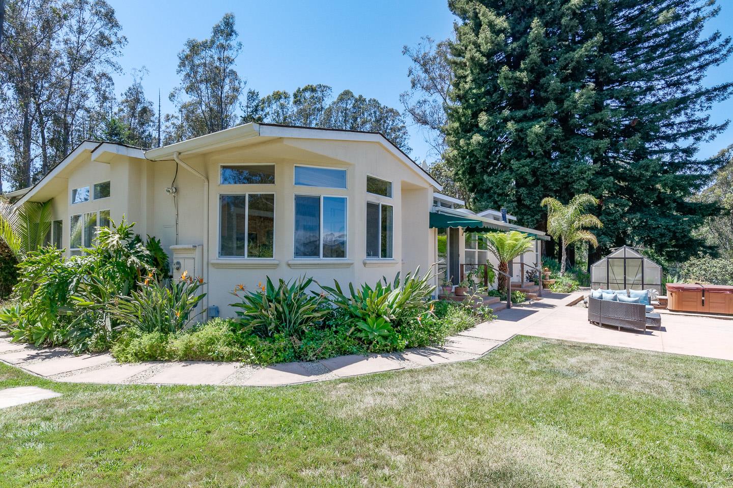 892-894 Calabasas Road Watsonville, CA 95076 - Photo 3 of 53 a front view of a house with a yard