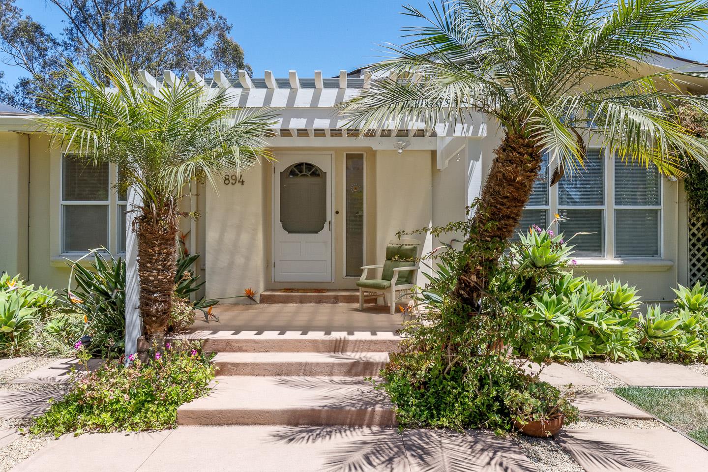 892-894 Calabasas Road Watsonville, CA 95076 - Photo 6 of 53 a front view of a house with a garden