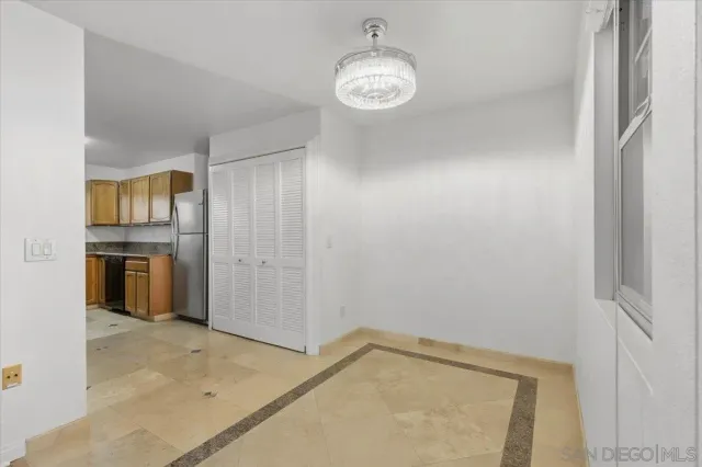 a kitchen with a sink stove top oven and cabinets