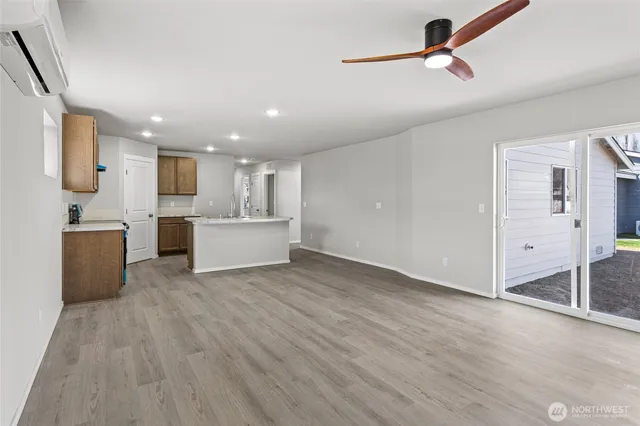 a view of a kitchen with microwave and cabinets