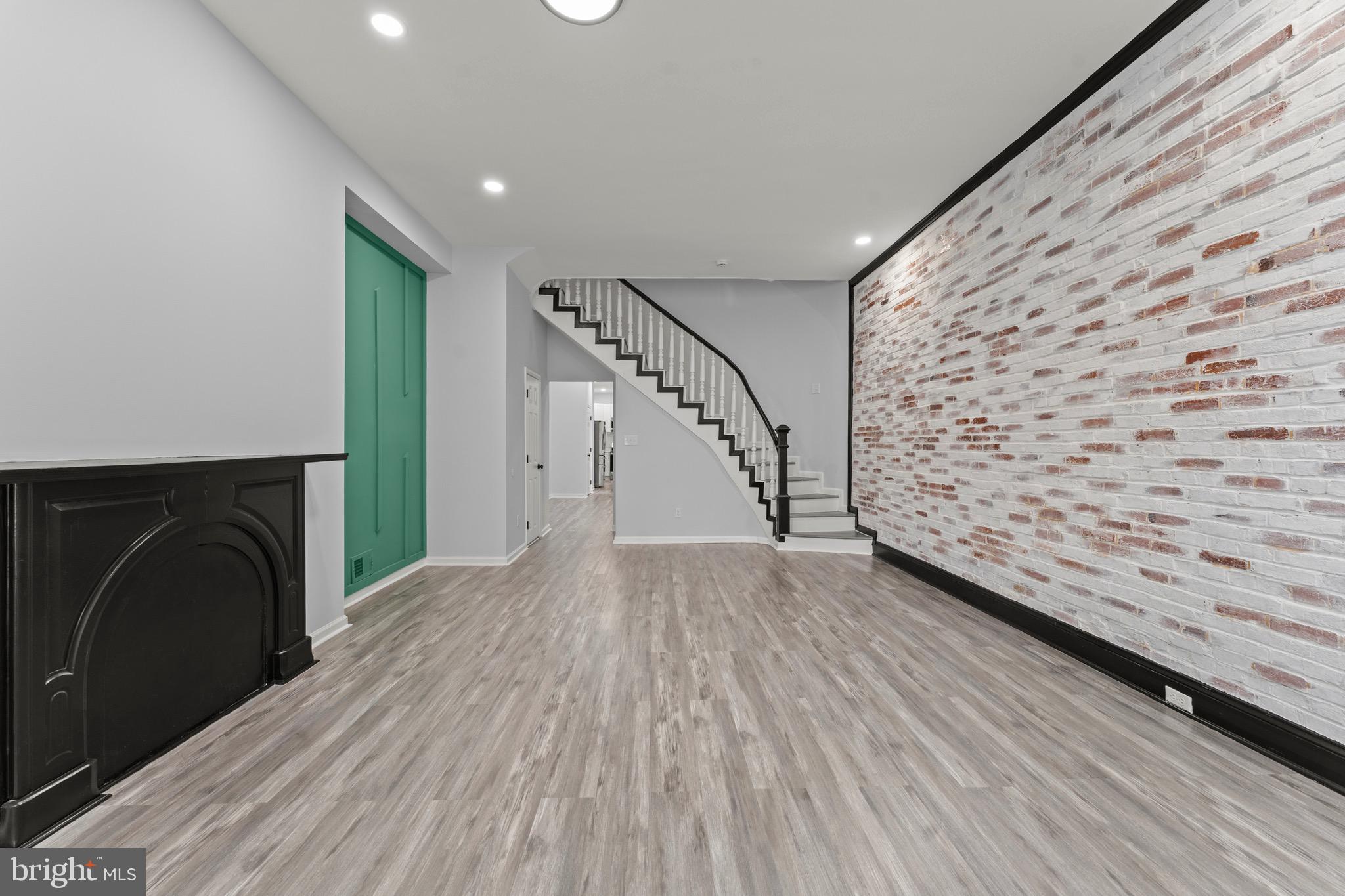 a view of entryway with wooden floor