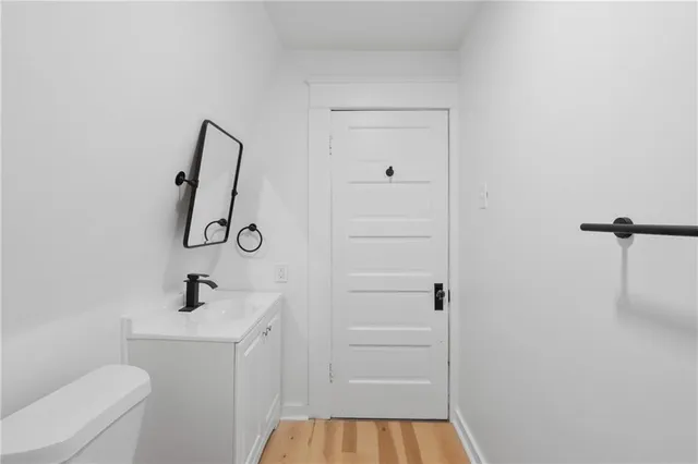 a bathroom with a shower toilet and sink