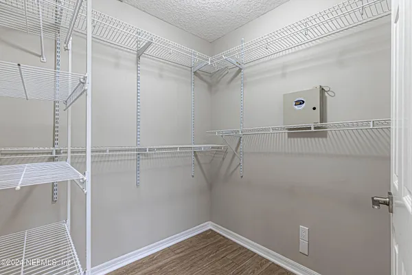 a view of a room with racks on the wall