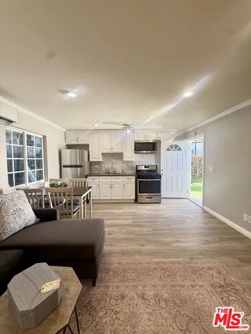 a living room with furniture and a table