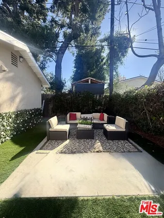a view of a outdoor sitting area with furniture