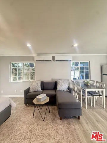 a living room with furniture and a table