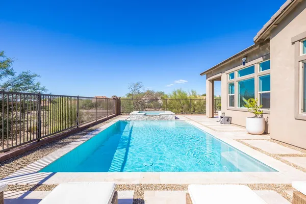 a view of swimming pool with a patio