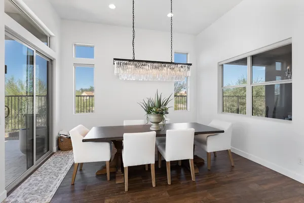 a view of a dining room with furniture window and wooden floor