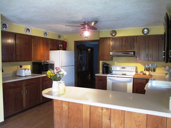 105 George Hill Road Grafton, MA 01519 - Photo 3 of 22 a kitchen with a refrigerator and a sink