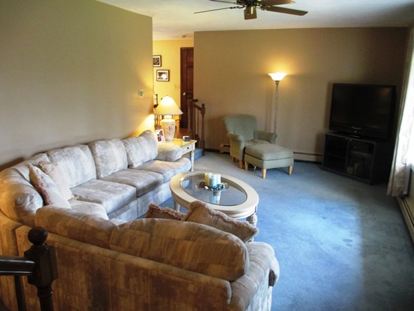 105 George Hill Road Grafton, MA 01519 - Photo 7 of 22 a living room with furniture and a flat screen tv