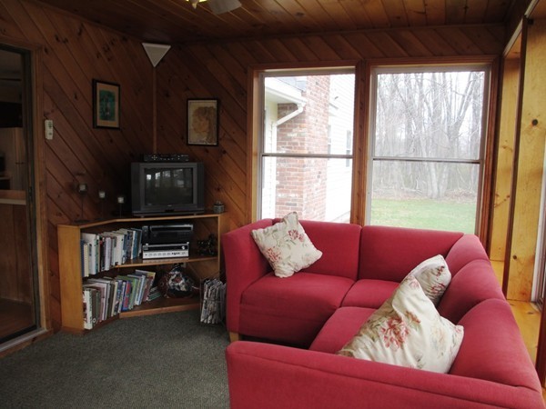 105 George Hill Road Grafton, MA 01519 - Photo 10 of 22 a living room with furniture a ceiling fan and a window