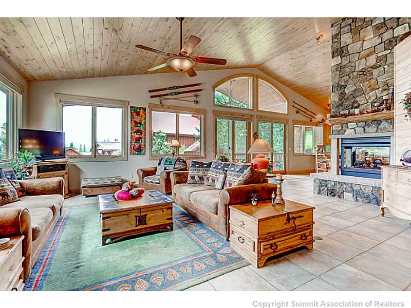 729 Willowbrook Road Silverthorne, CO 80498 - Photo 5 of 25 Living Room. Large open concept main floor living with a three sided 3000 BTU fire place.