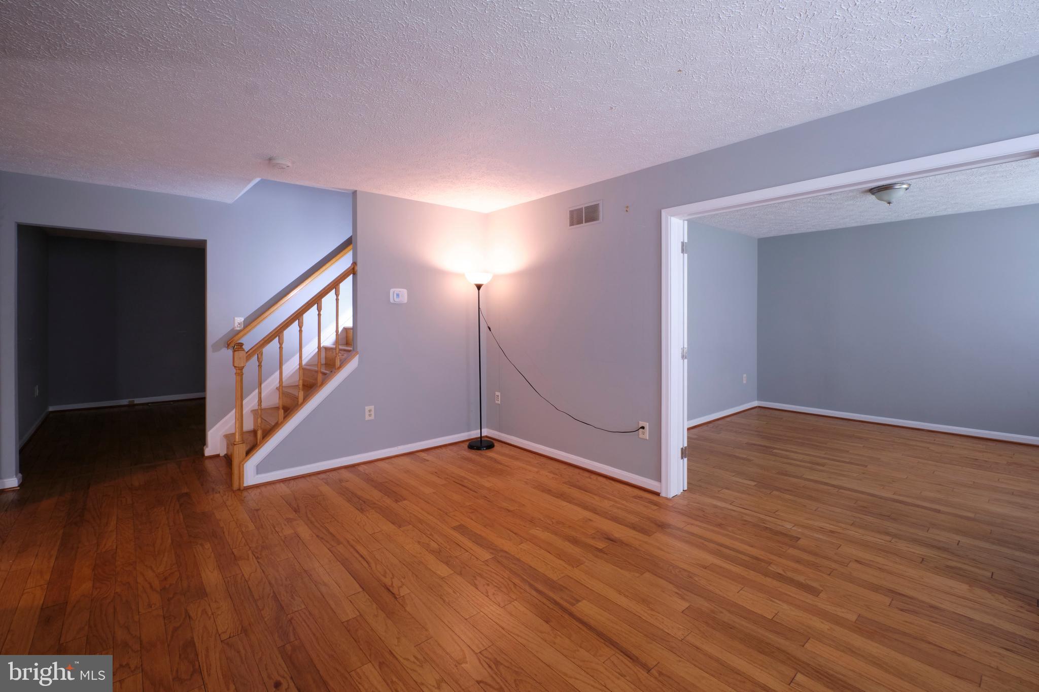 9046 Naygall Road Baltimore, MD 21234 - Photo 10 of 43 living room w/ view to stairs to upper level