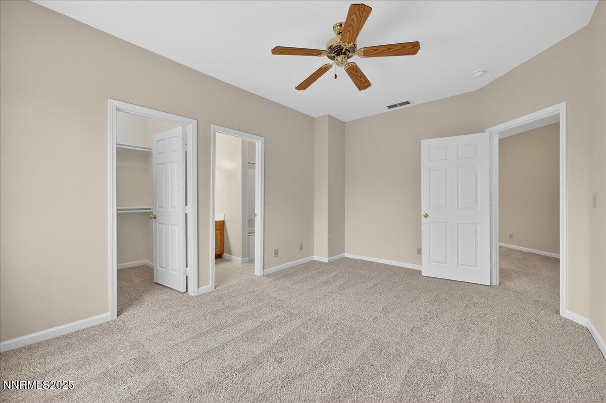 900 South Meadows Parkway, Unit 2322 Reno, NV 89521 - Photo 16 of 40 an empty room with closet and a ceiling fan
