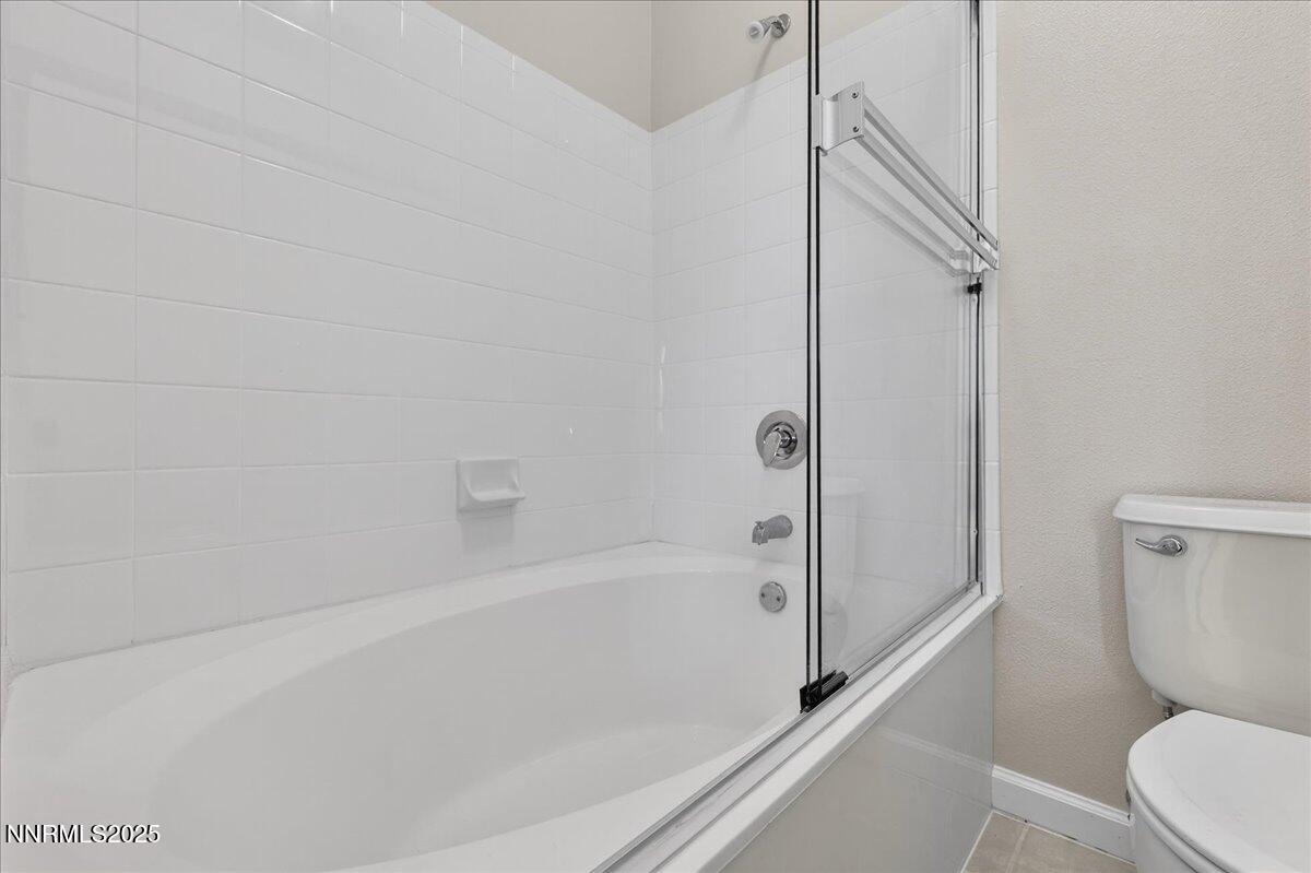 900 South Meadows Parkway, Unit 2322 Reno, NV 89521 - Photo 19 of 40 a bathroom with a toilet and a bathtub