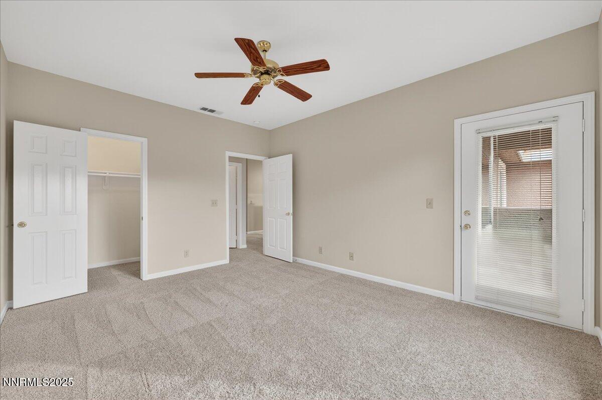 900 South Meadows Parkway, Unit 2322 Reno, NV 89521 - Photo 21 of 40 a view of a livingroom with a ceiling fan & windows
