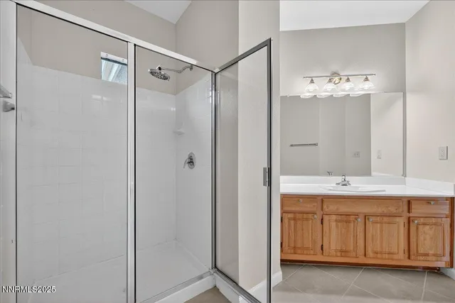 a bathroom with a shower and a sink