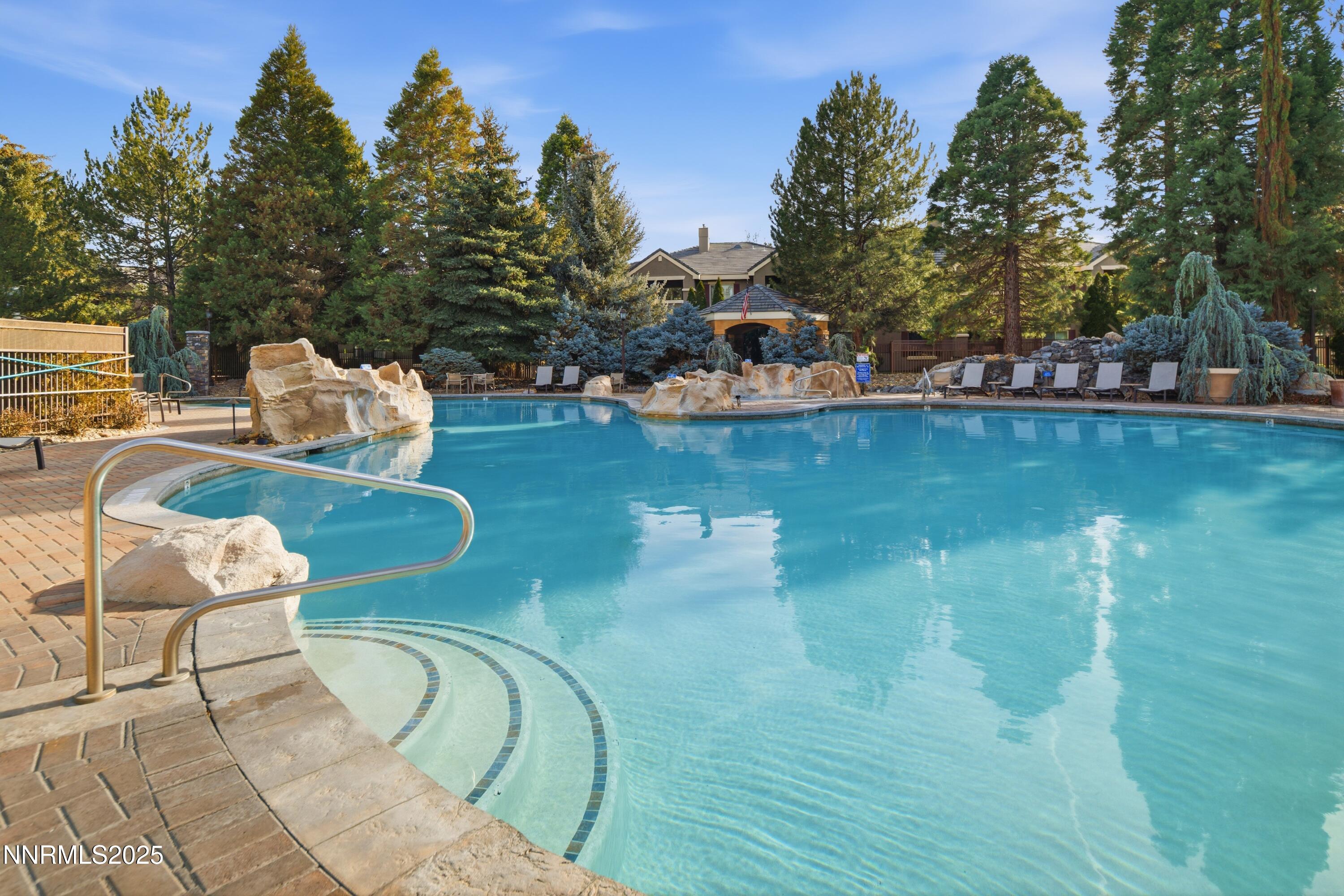 900 South Meadows Parkway, Unit 2322 Reno, NV 89521 - Photo 34 of 40 a view of a swimming pool with lounge chairs