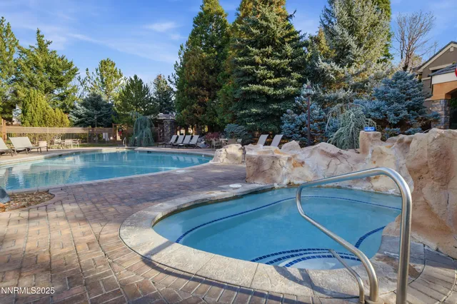 a view of a swimming pool with a yard