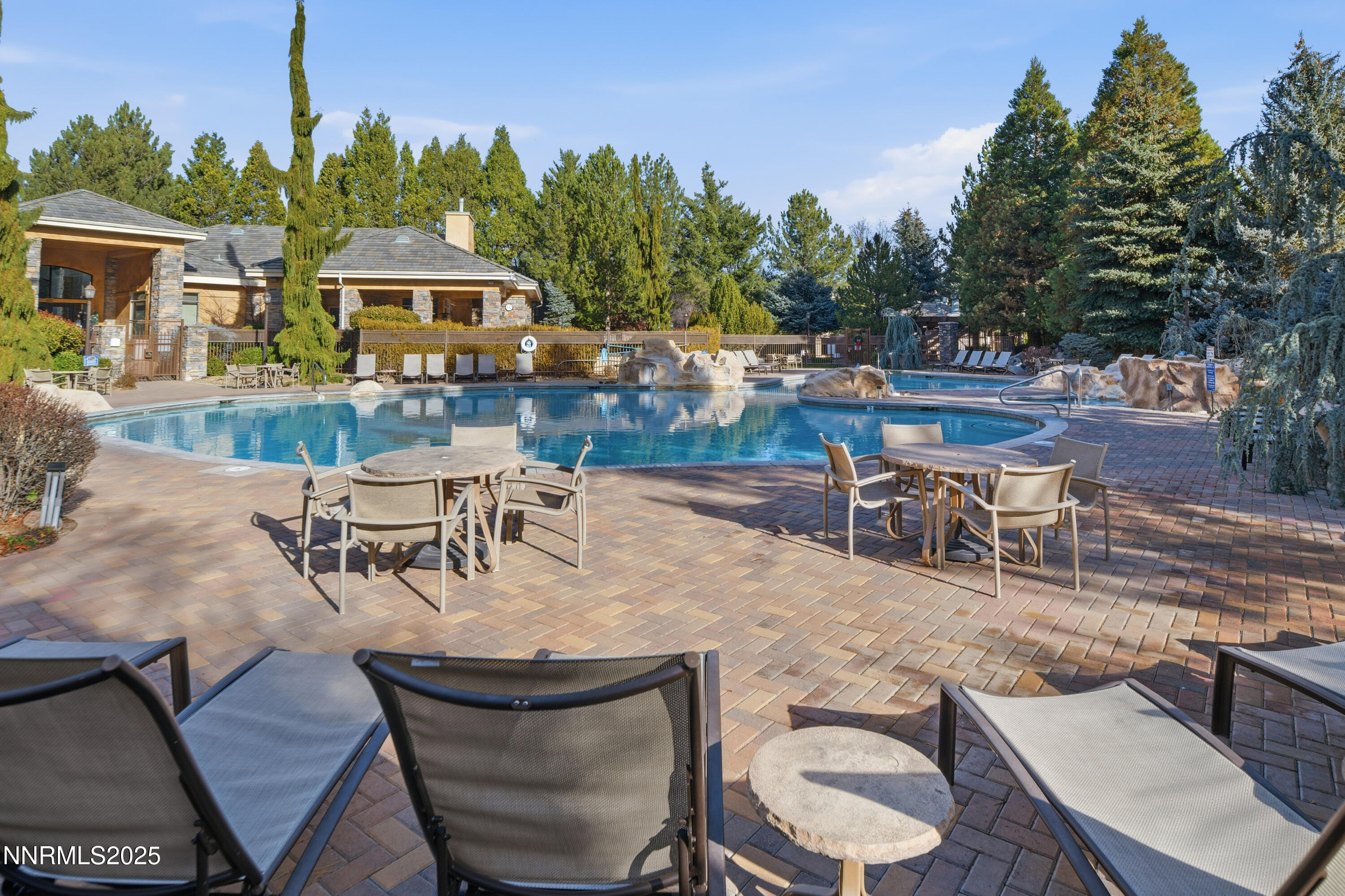 900 South Meadows Parkway, Unit 2322 Reno, NV 89521 - Photo 36 of 40 a view of a patio with table and chairs with wooden floor and fence