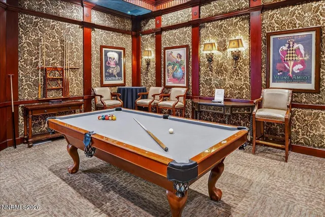 a view of a livingroom with furniture and a flat screen tv