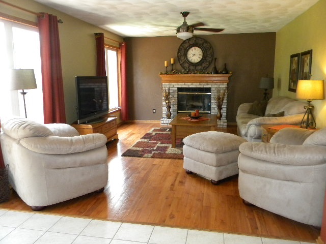 10745 Chicory Ridge Way Roscoe, IL 61073 - Photo 11 of 25 a living room with furniture and a fireplace
