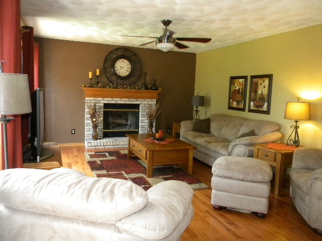 10745 Chicory Ridge Way Roscoe, IL 61073 - Photo 12 of 25 a living room with furniture and a fireplace