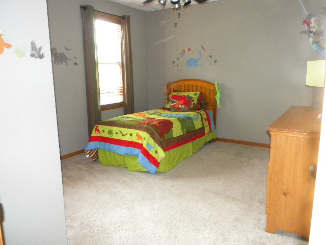 10745 Chicory Ridge Way Roscoe, IL 61073 - Photo 18 of 25 a room with a bed and a window