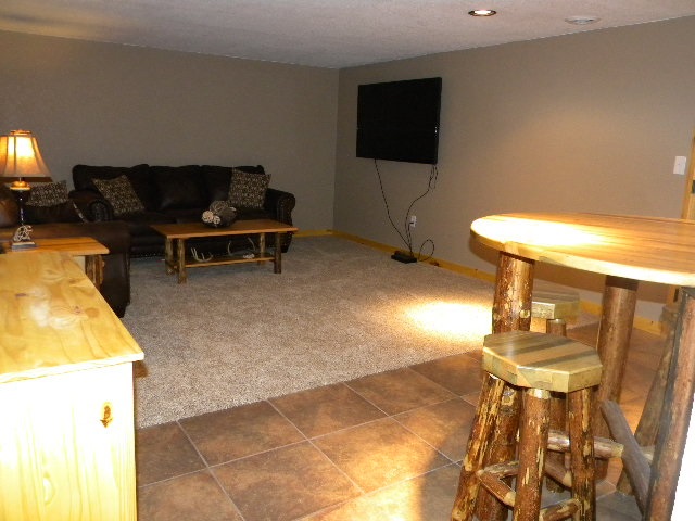 10745 Chicory Ridge Way Roscoe, IL 61073 - Photo 20 of 25 a living room with furniture and a flat screen tv