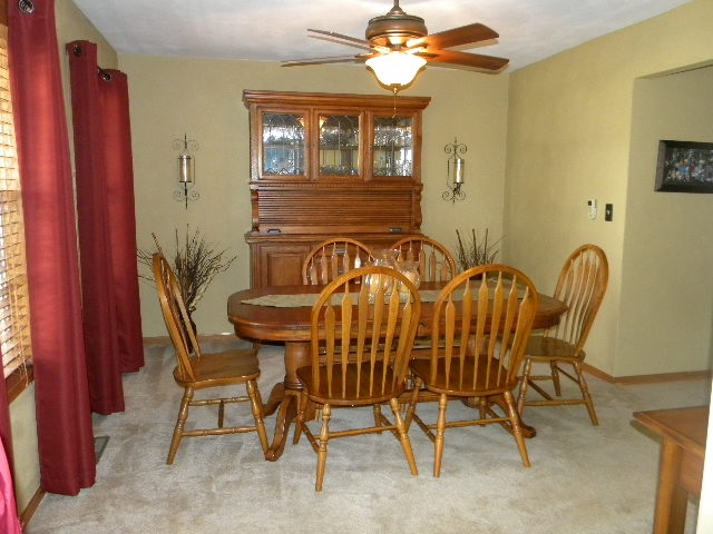 10745 Chicory Ridge Way Roscoe, IL 61073 - Photo 3 of 25 a view of a dining room with furniture and chandelier