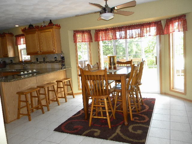 10745 Chicory Ridge Way Roscoe, IL 61073 - Photo 7 of 25 a view of a dining room with furniture window and outside view