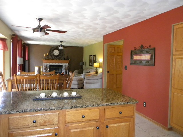 10745 Chicory Ridge Way Roscoe, IL 61073 - Photo 10 of 25 a kitchen with a sink and a refrigerator