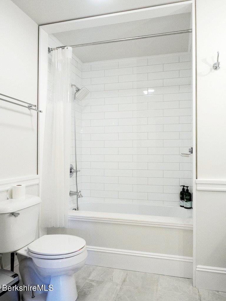664 Main Road Monterey, MA 01245 - Photo 16 of 19 a bathroom with a shower and a toilet