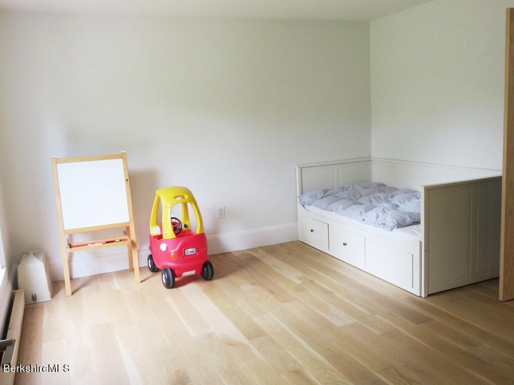664 Main Road Monterey, MA 01245 - Photo 8 of 19 a bedroom with a bed and a dresser