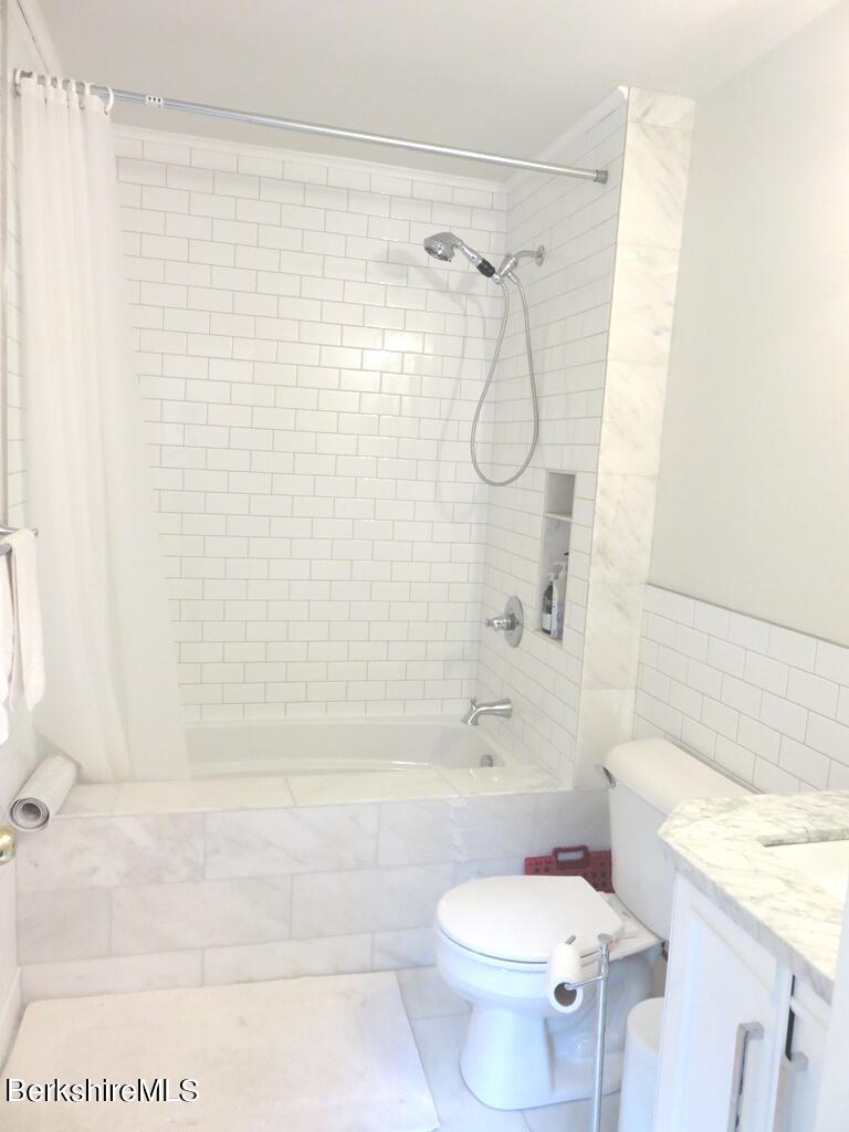 664 Main Road Monterey, MA 01245 - Photo 10 of 19 a bathroom with a bathtub shower sink and toilet
