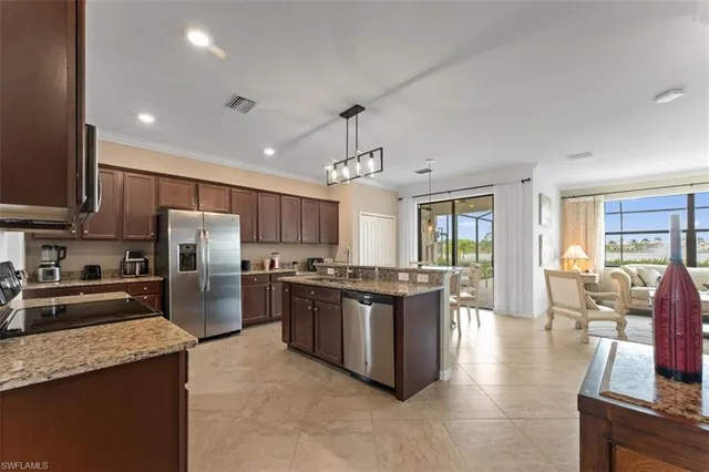 a kitchen with stainless steel appliances granite countertop a stove oven and a refrigerator
