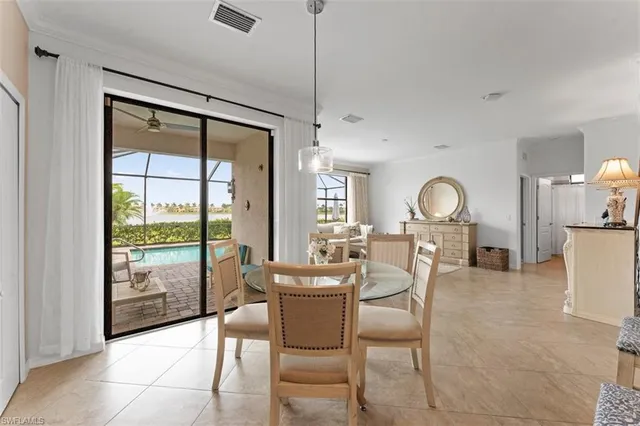 a living room with furniture a flat screen tv and a large window
