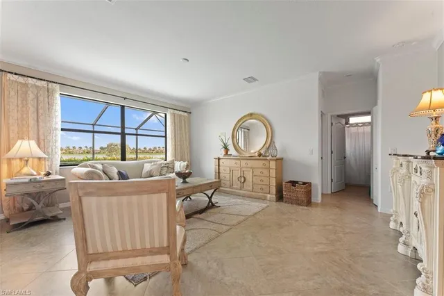 a living room with furniture a window and a fireplace