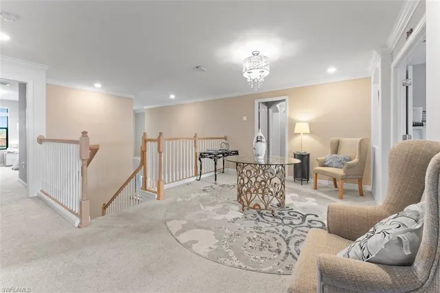 a living room with furniture a dining table and chairs