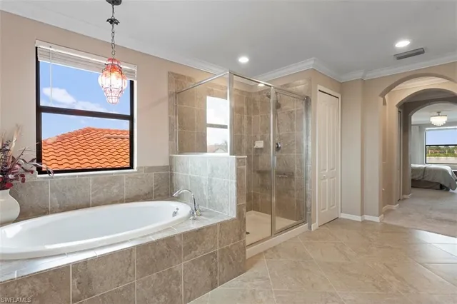 a bathroom with a bathtub and a shower